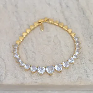 PULSEIRA CORAÇÃO RIVIERA COM PEDRAS CRISTAS BANHO OURO 18K
