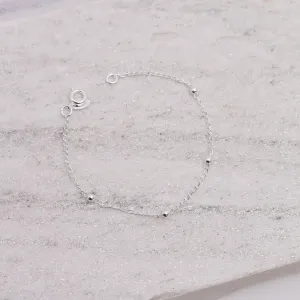 PULSEIRA INFANTIL COM BOLINHAS BANHO PRATA
