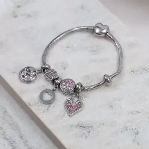 PULSEIRA 6 BERLOQUES COM ZIRCÔNIAS ROSA AÇO INOX