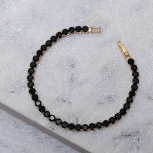PULSEIRA RIVIERA COM PEDRAS NEGRAS BANHO OURO 18K