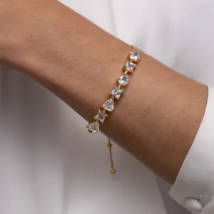 PULSEIRA CORAÇÃO COM PEDRAS CRISTAL FECHO GRAVATINHA BANHO OURO 18K
