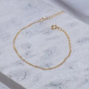 PULSEIRA TORCIDA FINA BANHO OURO 18K
