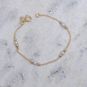 PULSEIRA INFANTIL PÉROLA E BOLINHAS LISAS BANHO OURO 18K