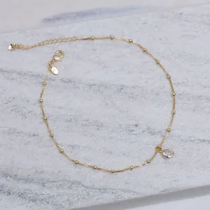 TORNOZELEIRA BOLINHAS COM PONTO DE LUZ BANHO OURO 18K