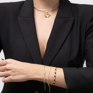 PULSEIRA TORCIDA COM TREVINHOS CRISTAIS BANHO OURO 18K