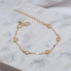PULSEIRA TORCIDA COM TREVINHOS CRISTAIS BANHO OURO 18K