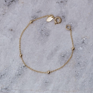 PULSEIRA INFANTIL BOLINHAS BANHO OURO 18K