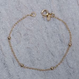 PULSEIRA INFANTIL BOLINHAS BANHO OURO 18K