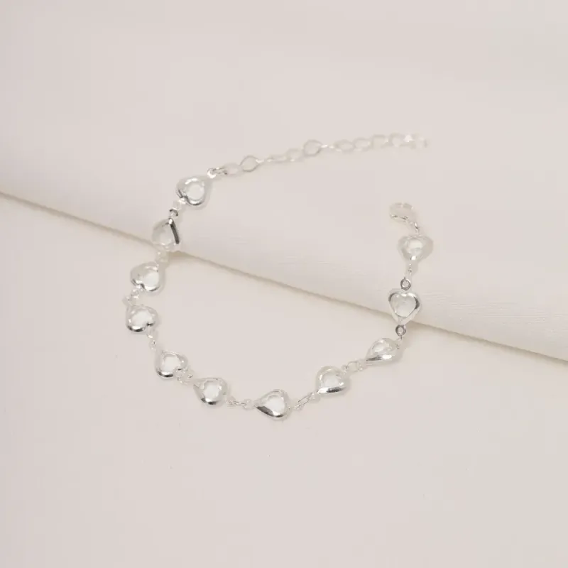 PULSEIRA ZIRCÔNIA COM CORAÇÕES VAZADOS BANHO PRATA