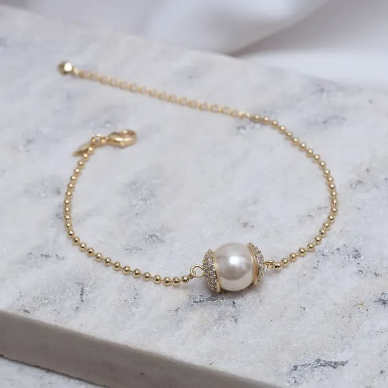 PULSEIRA PÉROLA COM ZIRCÔNIAS BANHO OURO 18K