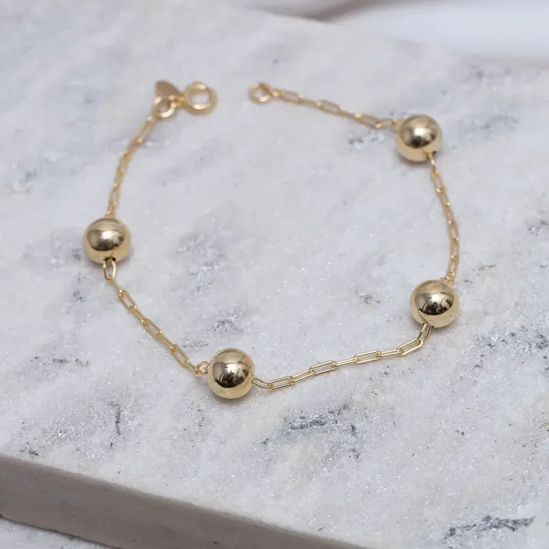 PULSEIRA BOLINHAS M LISAS BANHO OURO 18K