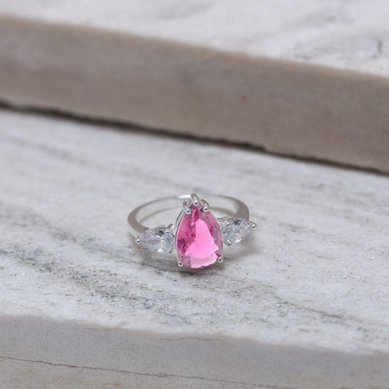 ANEL FORMATURA GOTA COM PEDRA ROSA IOGURTE BANHO PRATA