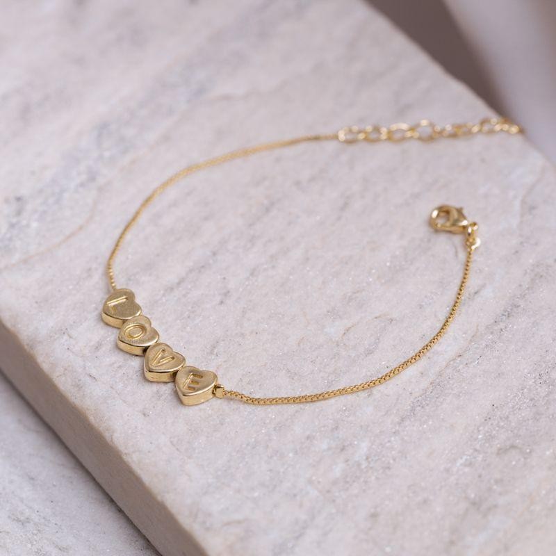 PULSEIRA CORAÇÕES E LOVE BANHO OURO 18K