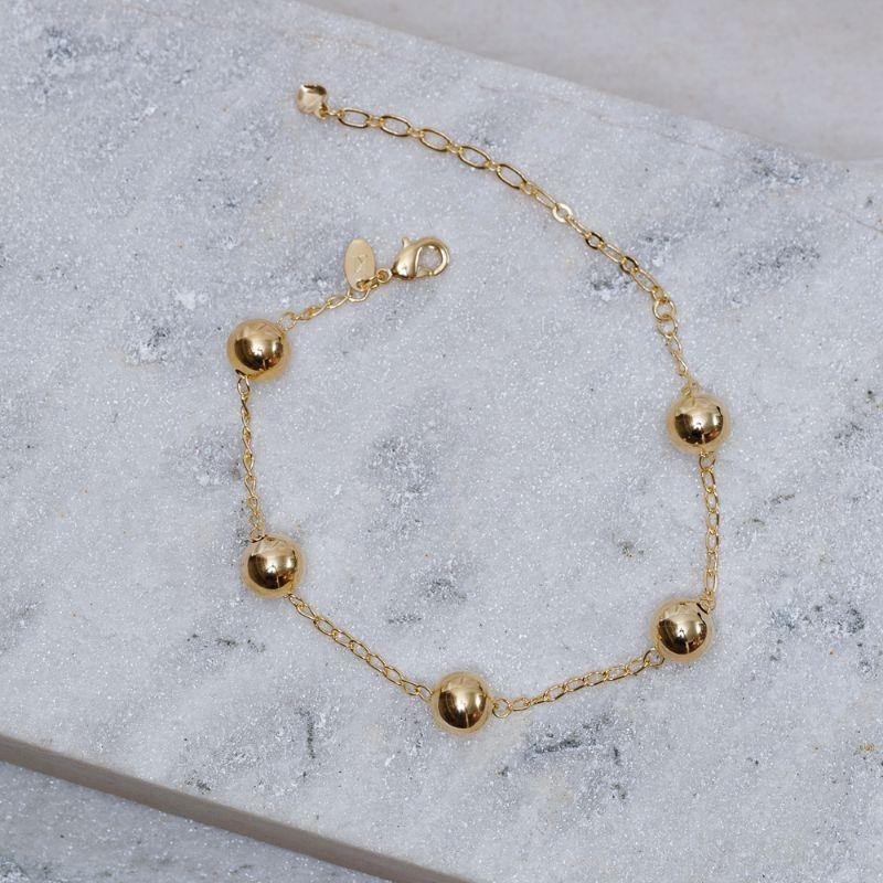 PULSEIRA BOLA LISA M BANHO OURO 18K