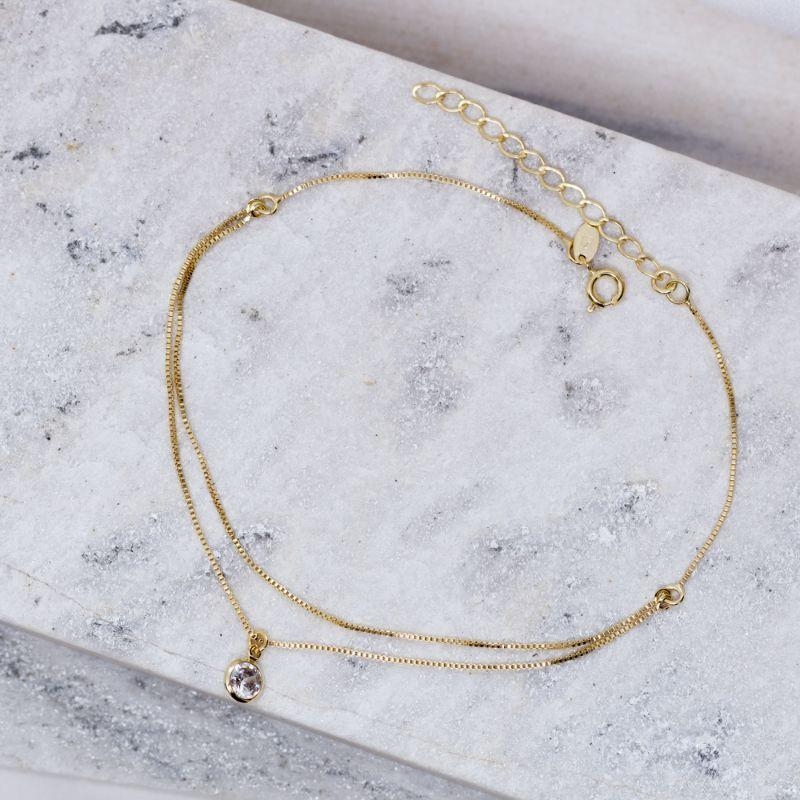 TORNOZELEIRA DUPLA COM CRISTAL BANHO OURO 18K