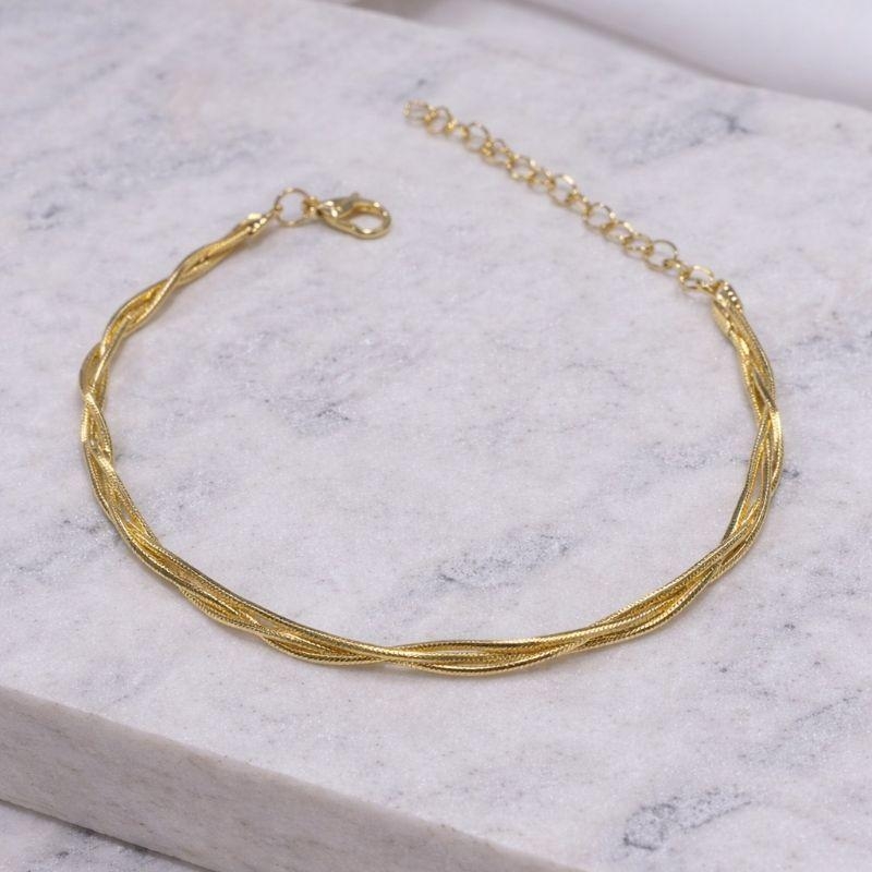 PULSEIRA TRANÇADA FINA BANHO OURO 18K