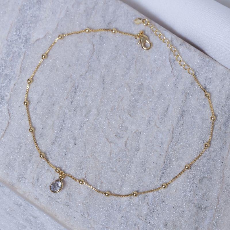 TORNOZELEIRA BOLINHAS COM PONTO DE LUZ BANHO OURO 18K