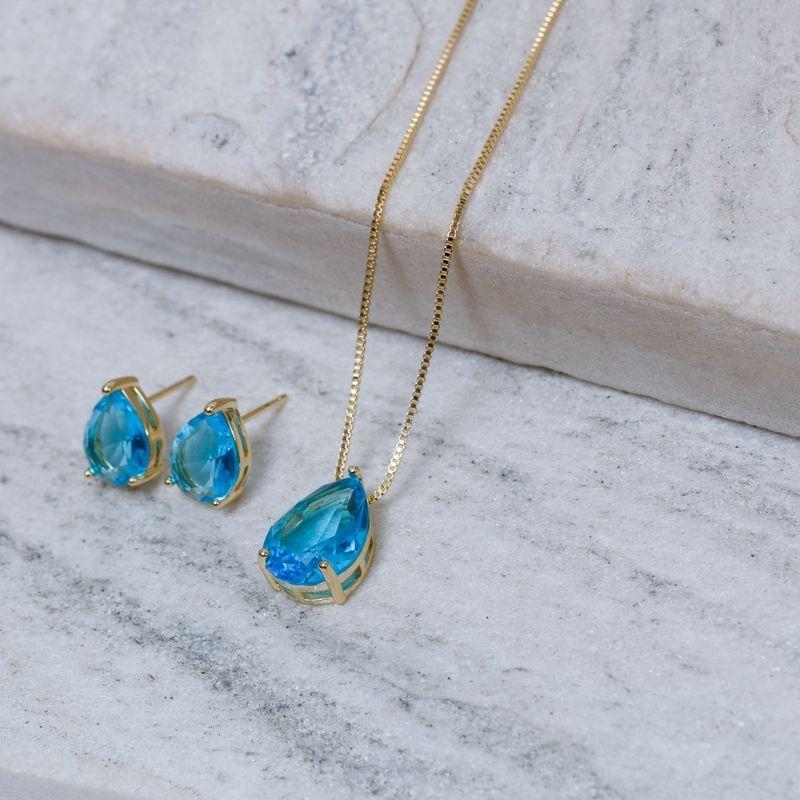CONJUNTO GOTA COM PEDRA AZUL CLARO BANHO OURO 18K