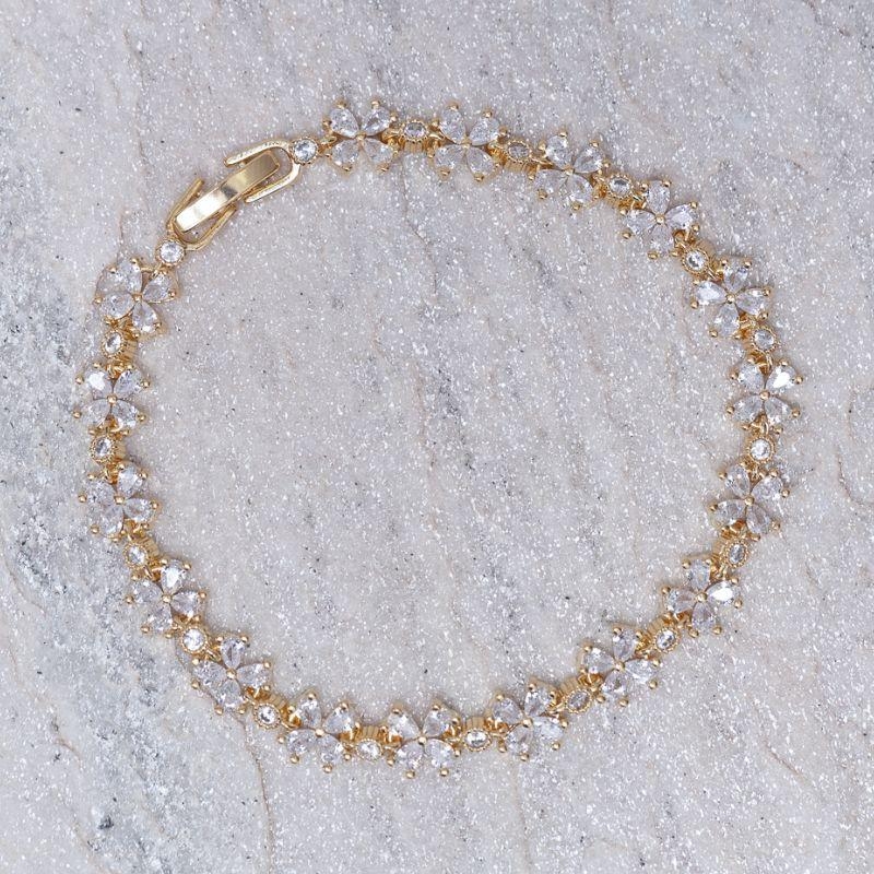 PULSEIRA FLORZINHA RIVIERA CRISTAL BANHO OURO 18K