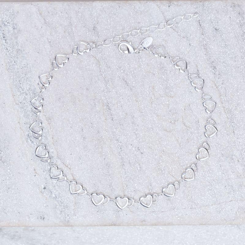 PULSEIRA INFANTIL CORAÇÕES VAZADOS BANHO PRATA