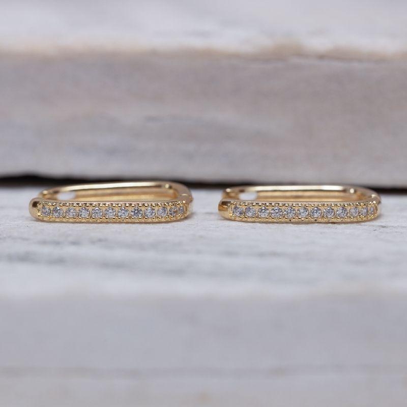 BRINCO ARGOLA OVAL CRAVEJADA G BANHO OURO 18K