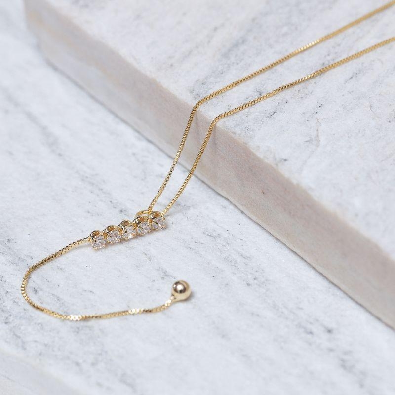 COLAR PÊNDULO COM ZIRCÔNIAS BANHO OURO 18K