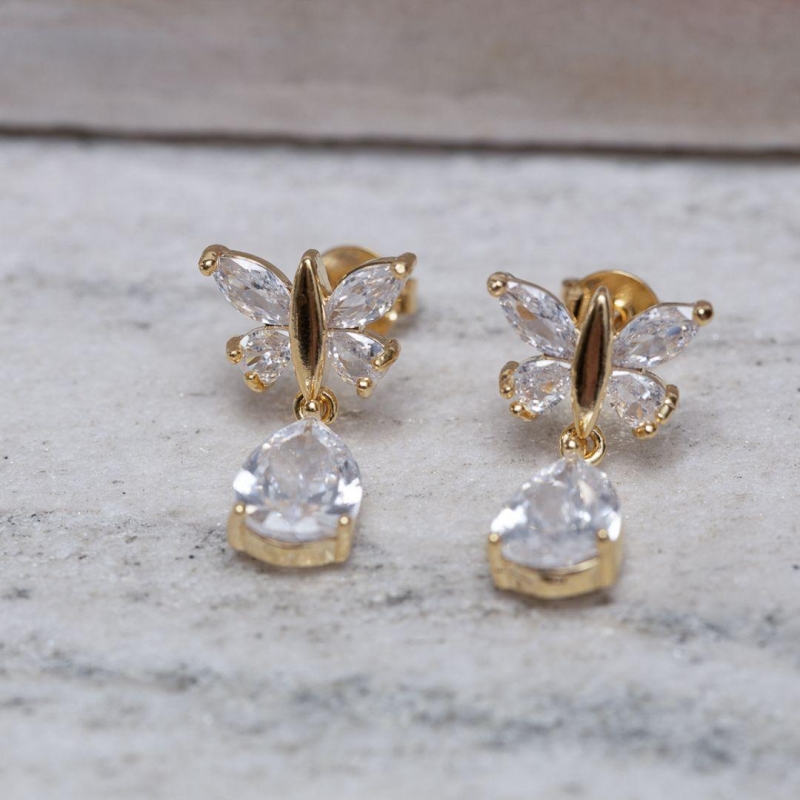 BRINCO LIBÉLULA COM PEDRA CRISTAL BANHO OURO 18K
