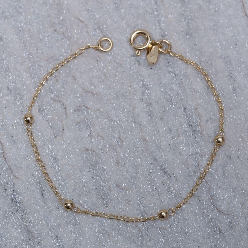 PULSEIRA INFANTIL BOLINHAS BANHO OURO 18K
