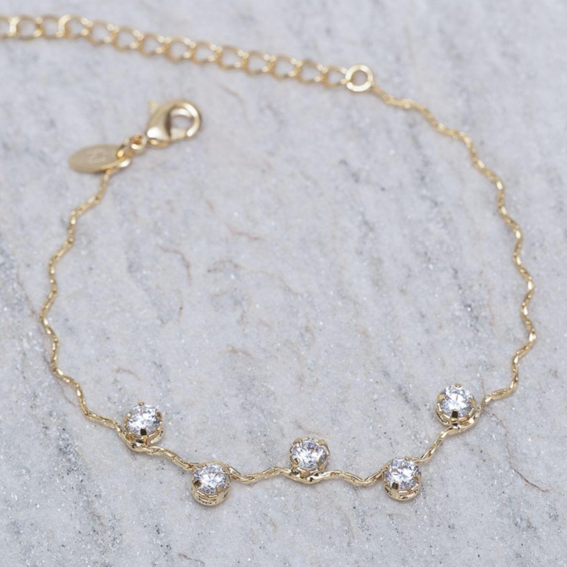 PULSEIRA ONDULADA COM PEDRAS CRISTAIS BANHO 18K