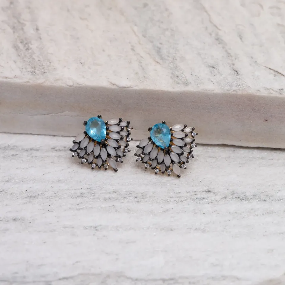 BRINCO COM PEDRA AZUL E CANETA RÓDIO NEGRO BANHO OURO 18K