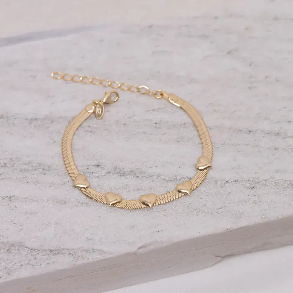 PULSEIRA FITA COM CORAÇÕES BANHO OURO 18K