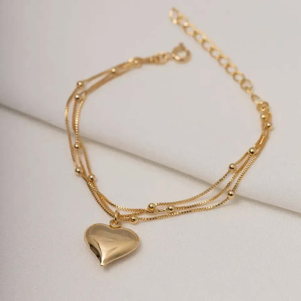 PULSEIRA TRIPLA COM PINGENTE DE CORAÇÃO E BOLINHAS BANHO OURO 18K