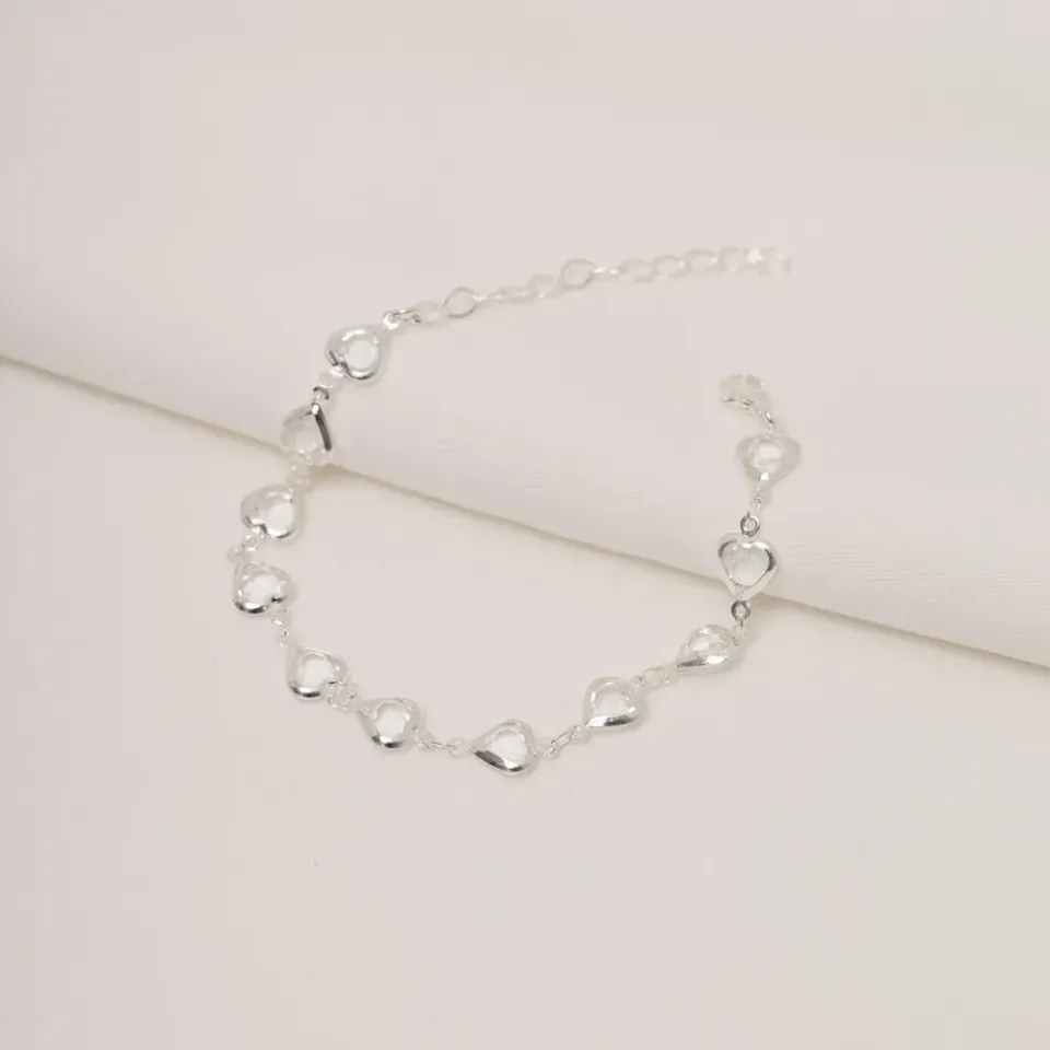 PULSEIRA ZIRCÔNIA COM CORAÇÕES VAZADOS BANHO PRATA