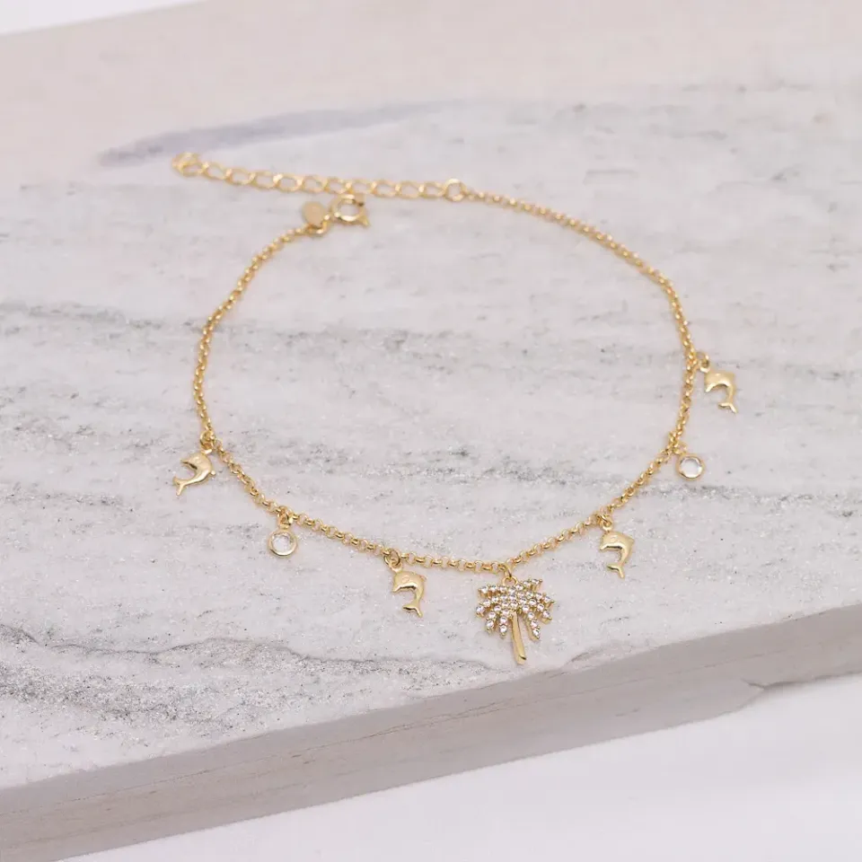 TORNOZELEIRA GOLFINHO, COQUEIRO E CRISTAL BANHO OURO 18K
