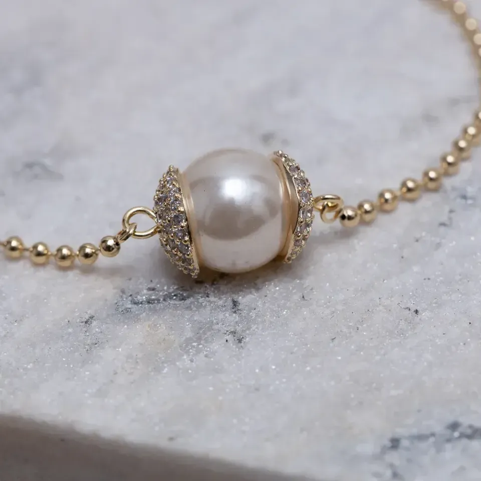 PULSEIRA PÉROLA COM ZIRCÔNIAS BANHO OURO 18K