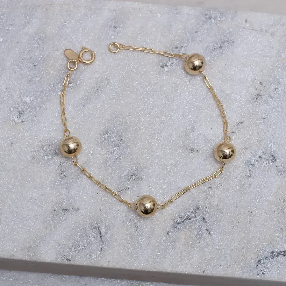 PULSEIRA BOLINHAS M LISAS BANHO OURO 18K