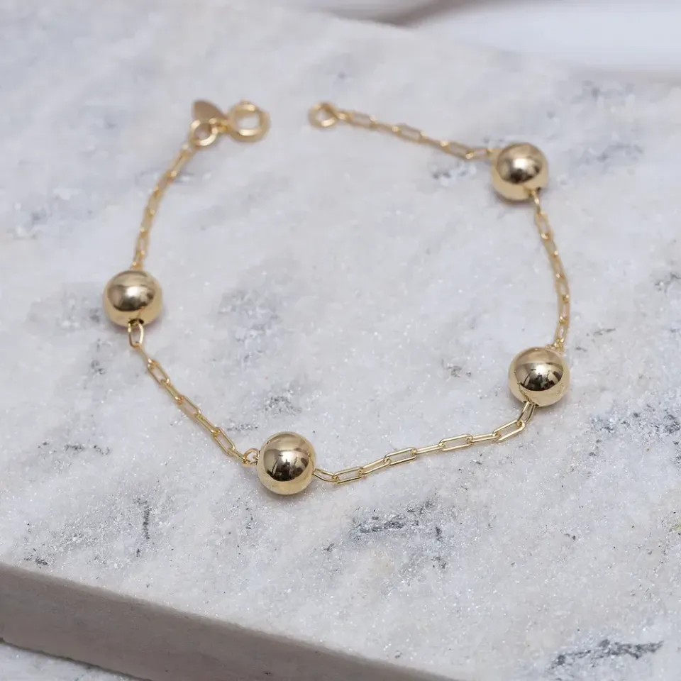 PULSEIRA BOLINHAS M LISAS BANHO OURO 18K