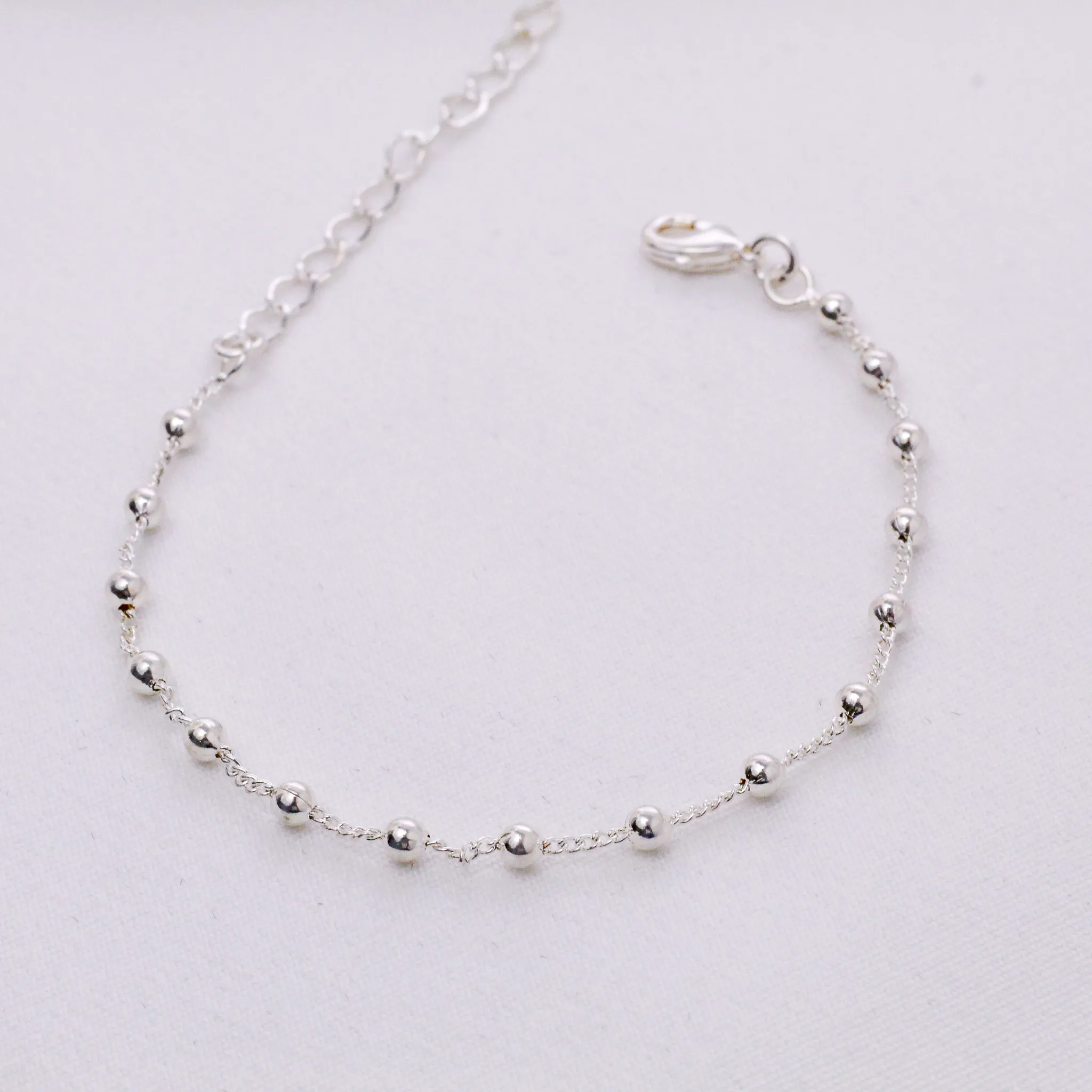 PULSEIRA BOLINHAS PEQUENAS BANHO PRATA