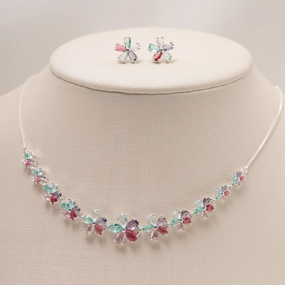 CONJUNTO FLOR COM PEDRAS COLORIDAS BANHO PRATA