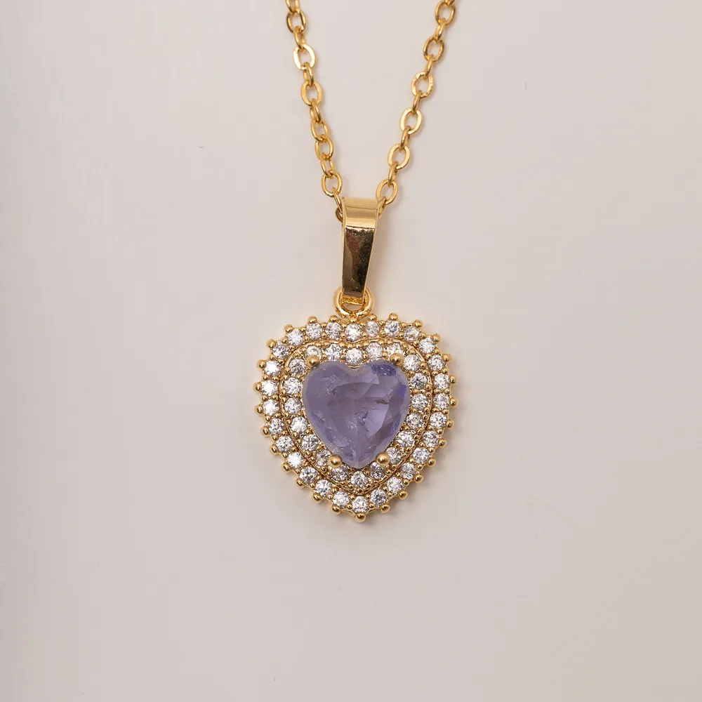 CONJUNTO CORAÇÃO COM PEDRA ZIRCÔNIA ROXA BANHO OURO 18K
