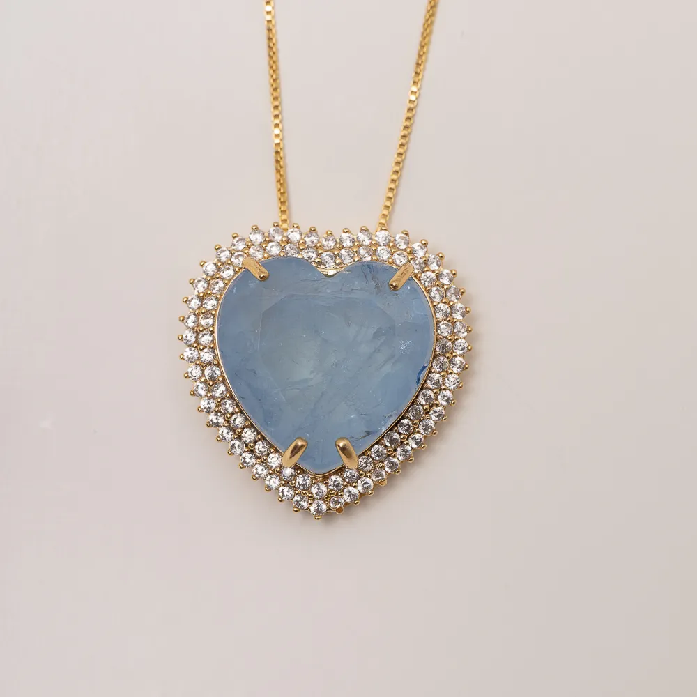 CONJUNTO CORAÇÃO COM ZIRCÔNIAS E PEDRA COR AZUL CLARO BANHO OURO 18K