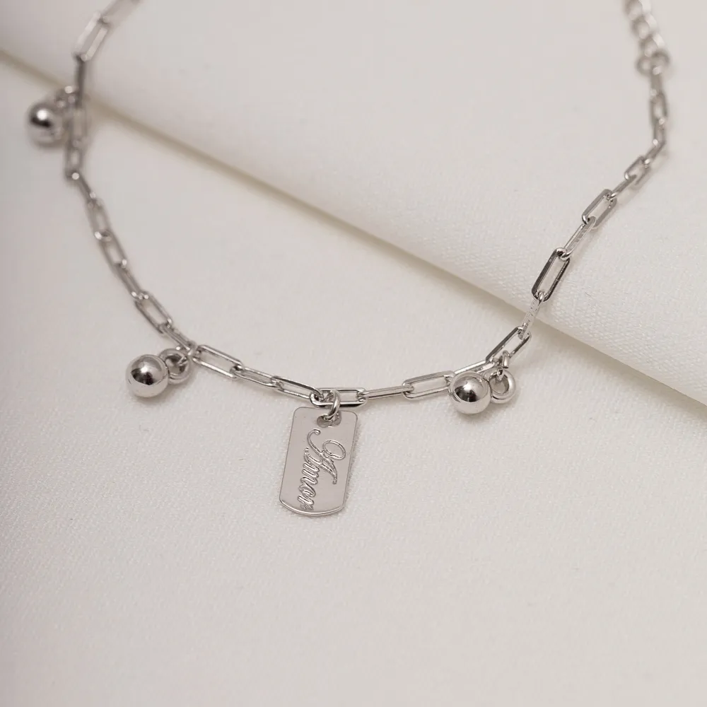 PULSEIRA COM BOLINHAS E PLACA AMOR BANHO RÓDIO BRANCO