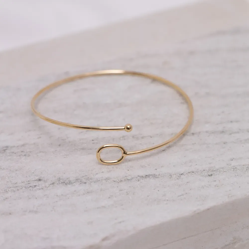 BRACELETE ABERTO COM CÍRCULO BANHO OURO 18K
