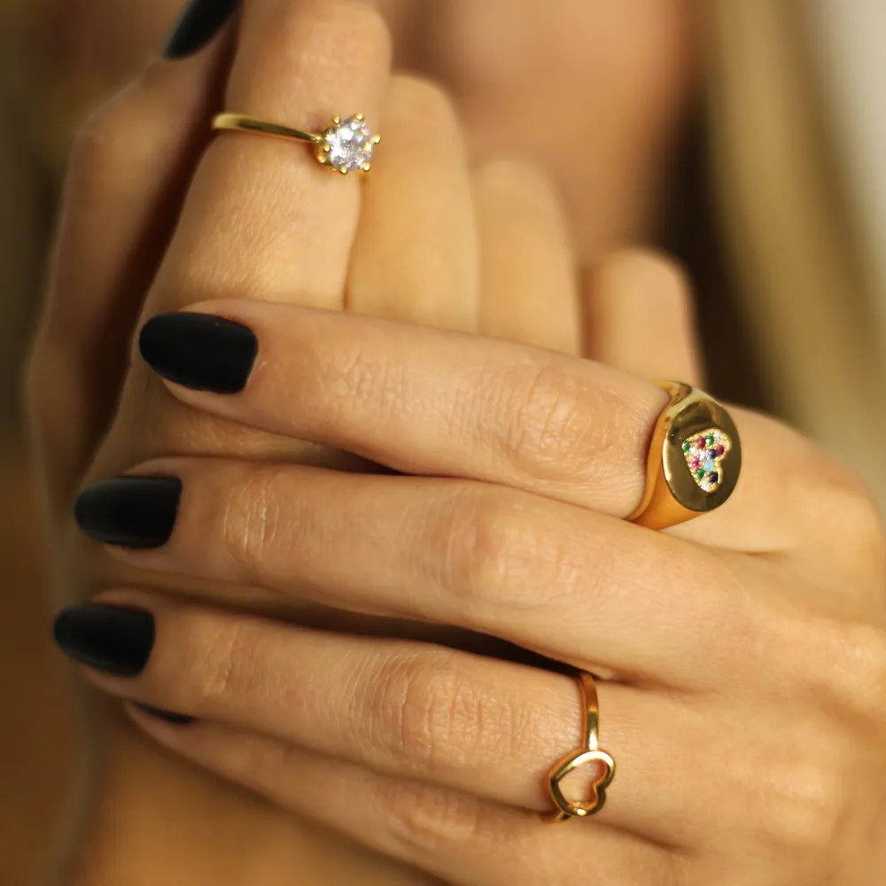 ANEL CORAÇÃO LISO VAZADO BANHO OURO 18K