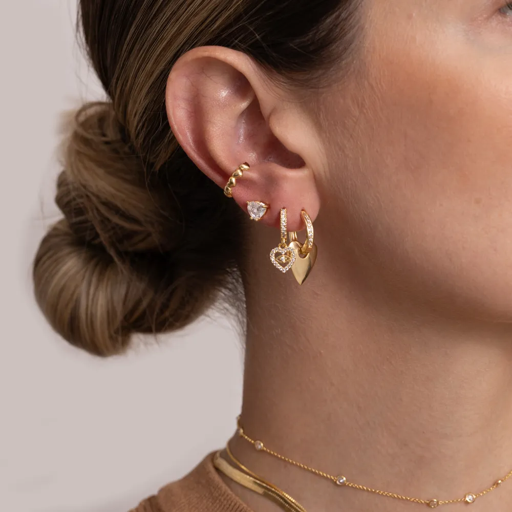 BRINCO ARGOLA OLHO GREGO E CORAÇÃO CRAVEJADO COM ZIRCÔNIAS CRISTAIS BANHO OURO 18K