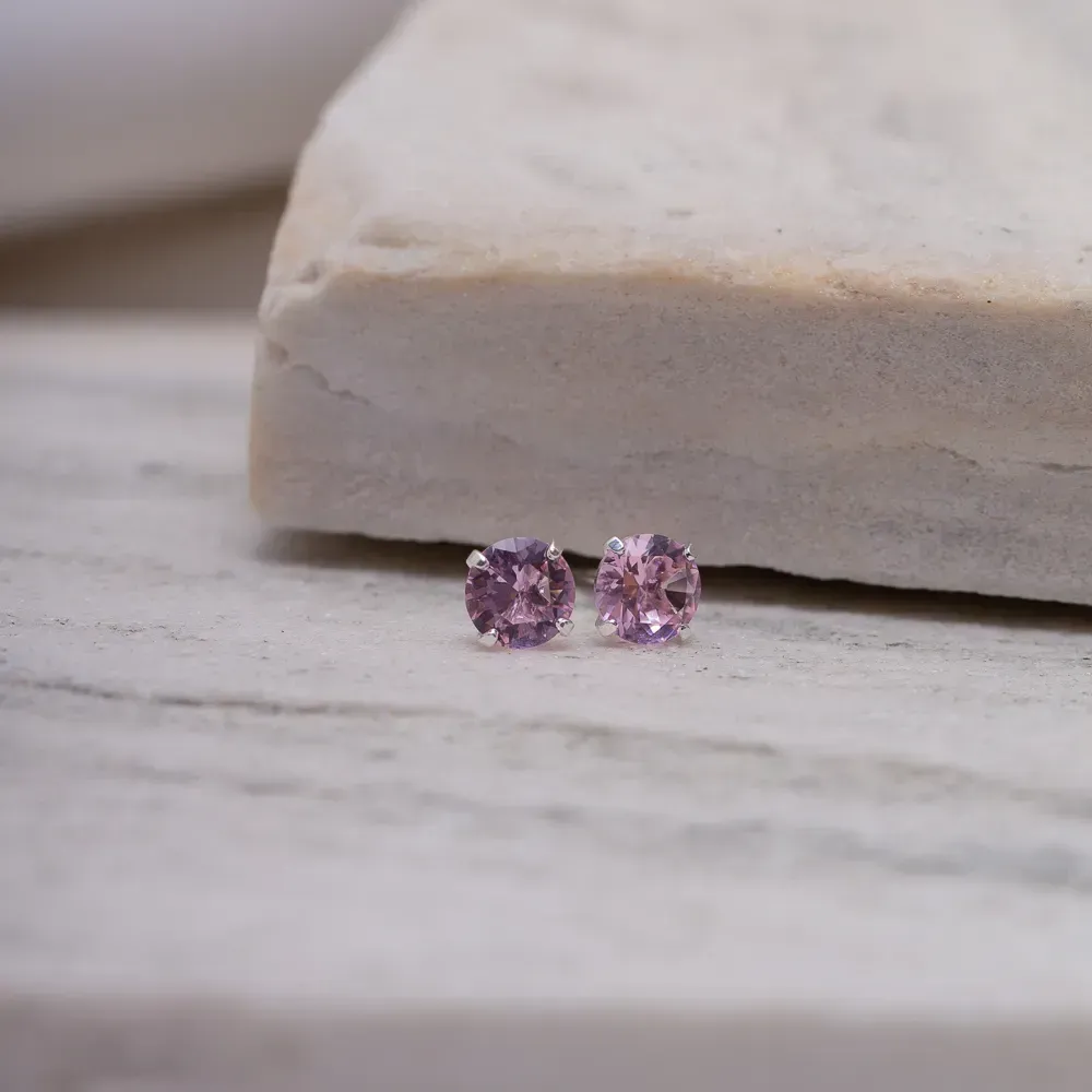 BRINCO PONTO DE LUZ ZIRCÔNIA ROSA CLARO BANHO PRATA