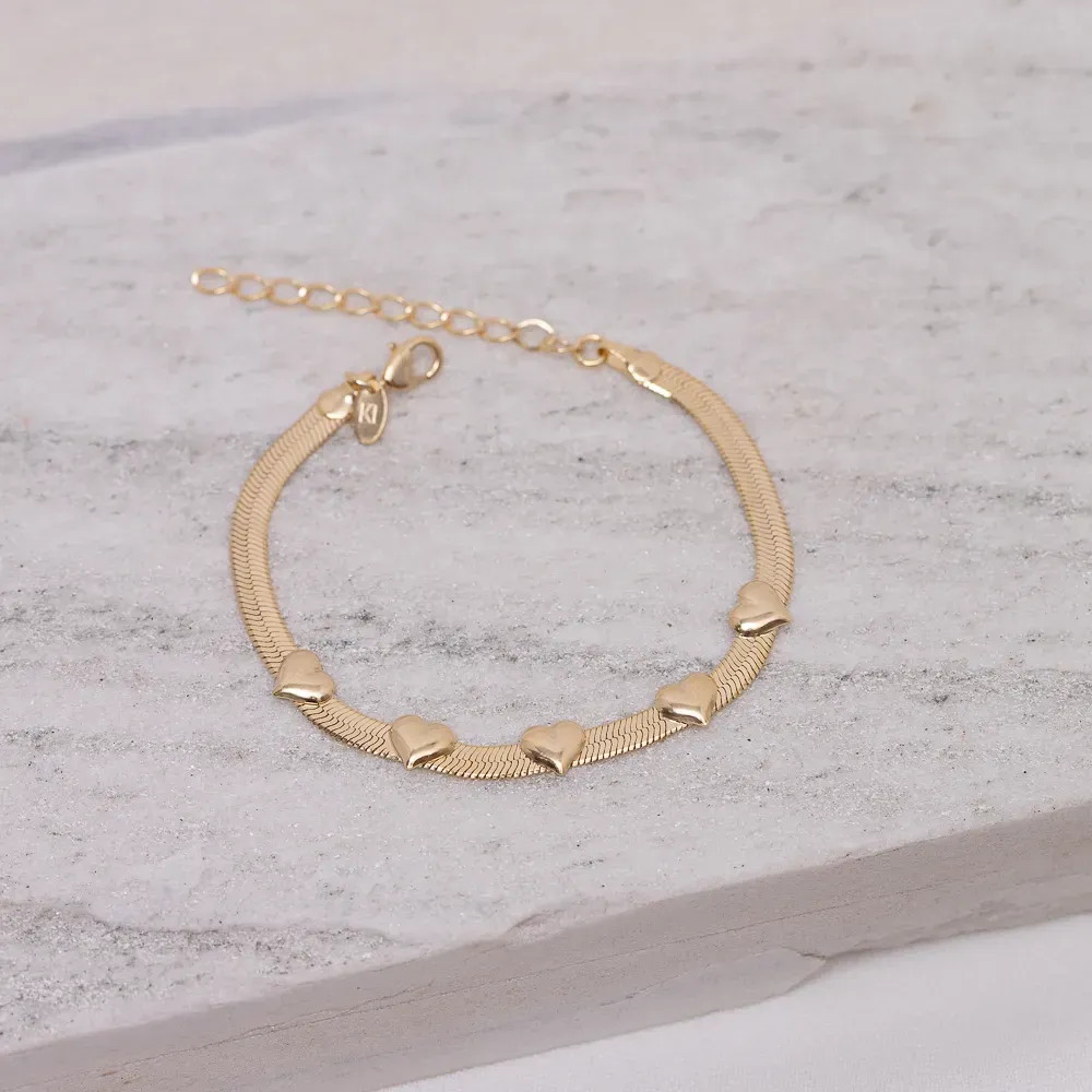 PULSEIRA FITA COM CORAÇÕES BANHO OURO 18K