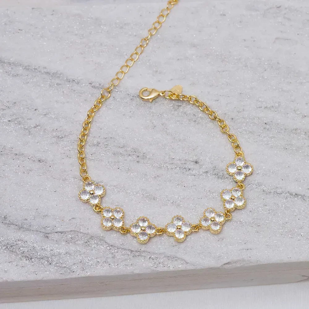 PULSEIRA FLOR CRAVEJADA COM ZIRCÔNIAS CRISTAIS BANHO OURO 18K