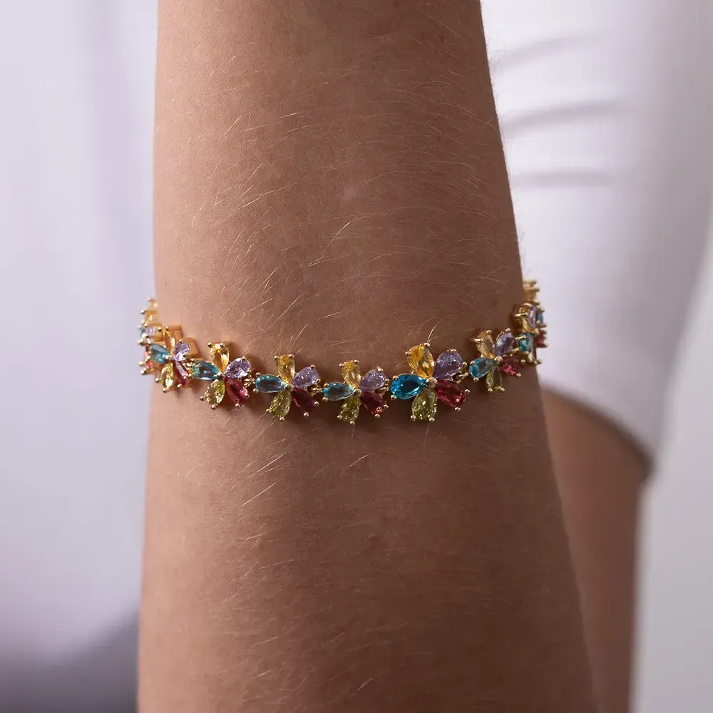PULSEIRA FLOR COM ZIRCÔNIAS COLORIDAS BANHO OURO 18K