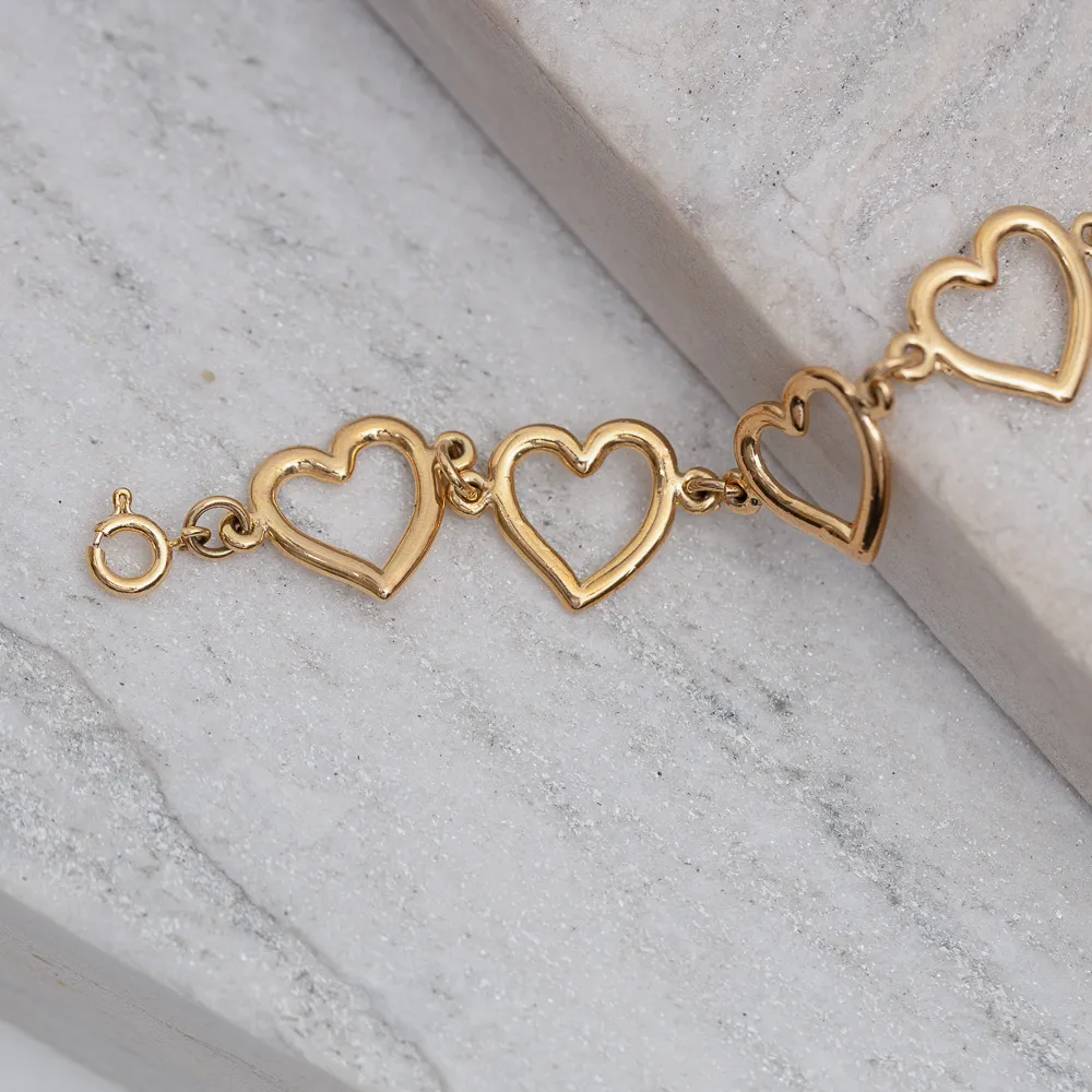 PULSEIRA CORAÇÕES LISOS VAZADOS BANHO OURO 18K